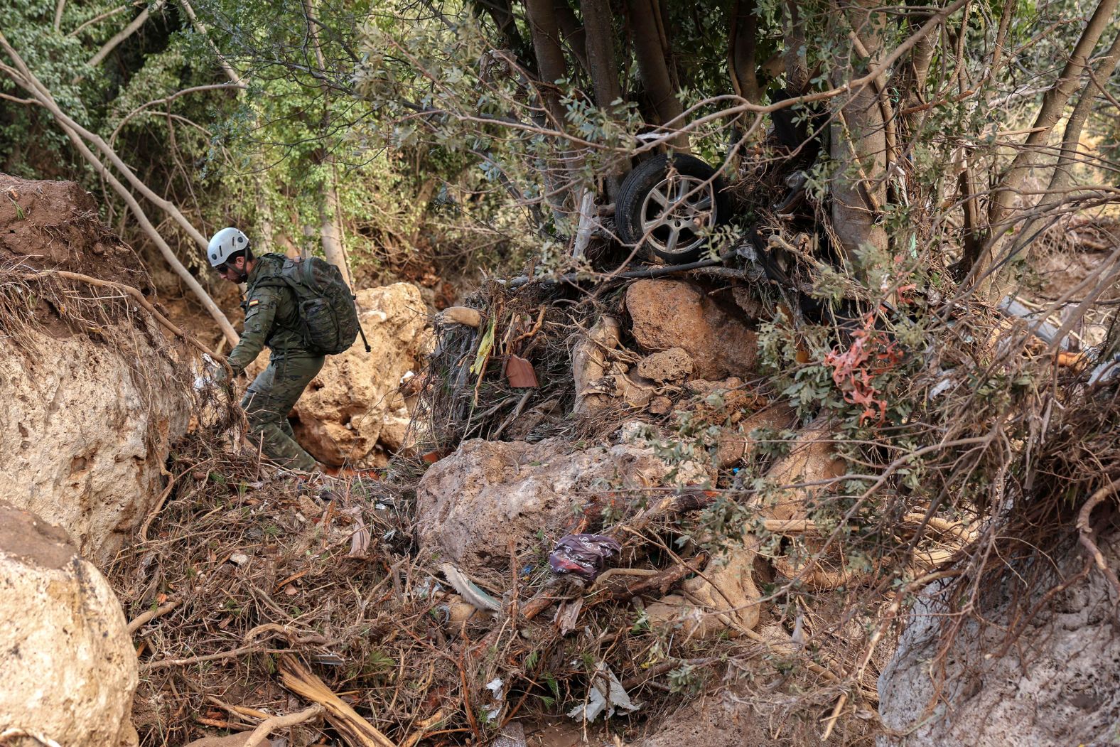 A member of the Emergency Military Unit searches for victims in Letur on Friday.