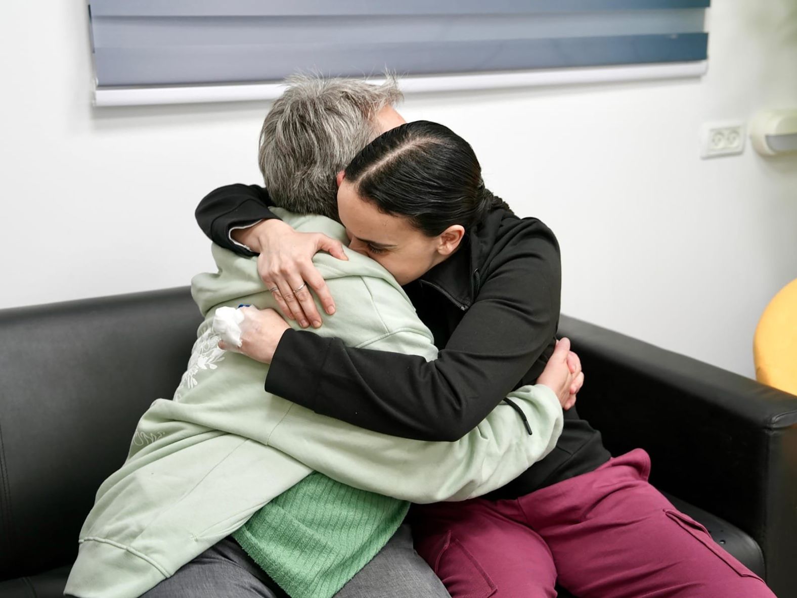 In this photo released by the Israeli military, Emily Damari, right, and her mother, Mandy, embrace near kibbutz Re’im, Israel, after Emily was released from captivity by Hamas militants in Gaza on Sunday, January 19. Three Israeli hostages and 90 Palestinian prisoners were released as part of the first phase of a <a href="index.php?page=&url=https%3A%2F%2Fwww.cnn.com%2F2025%2F01%2F14%2Fmiddleeast%2Fisrael-hamas-gaza-ceasefire-hostage-deal-explainer-intl">long-awaited ceasefire deal</a> between Hamas and Israel.