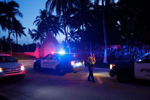 Police direct traffic outside an entrance to former President Donald Trump's Mar-a-Lago estate on August 8.