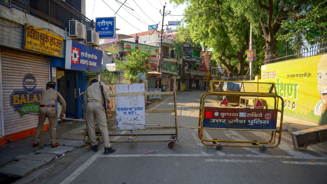 Police personnel block a street in Allahabad, India, on April 24.