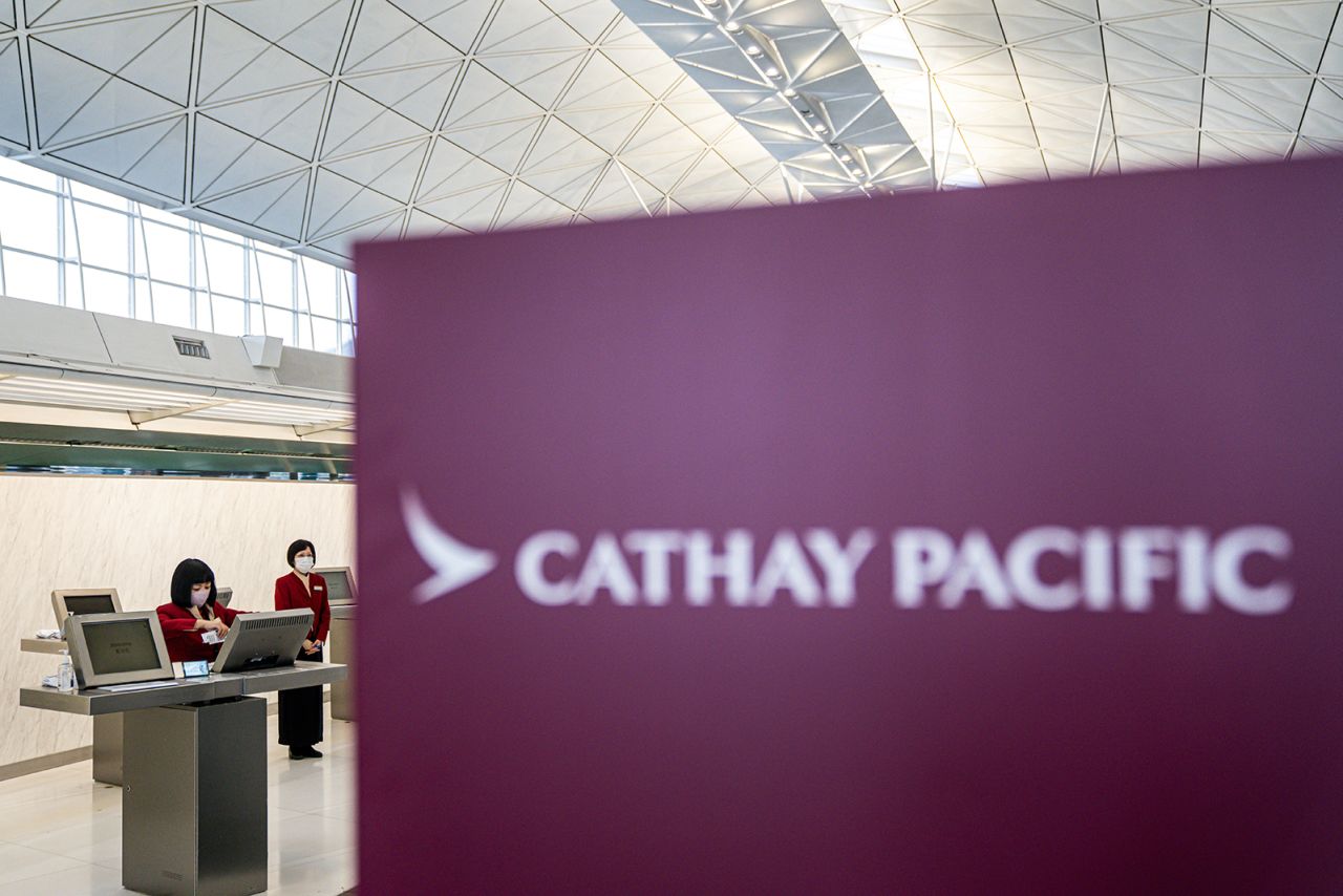 Signage for Cathay Pacific Airways Ltd. in the departure hall at Hong Kong International Airport in Hong Kong, China, on March 11.
