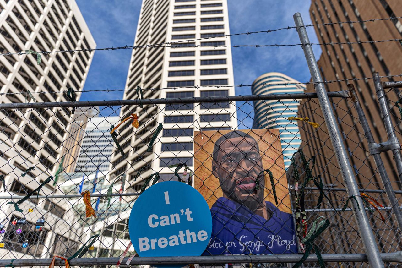 A poster with George Floyd's picture?hangs from a security fence outside the Hennepin County Government Center on March 30 in Minneapolis, Minnesota. 