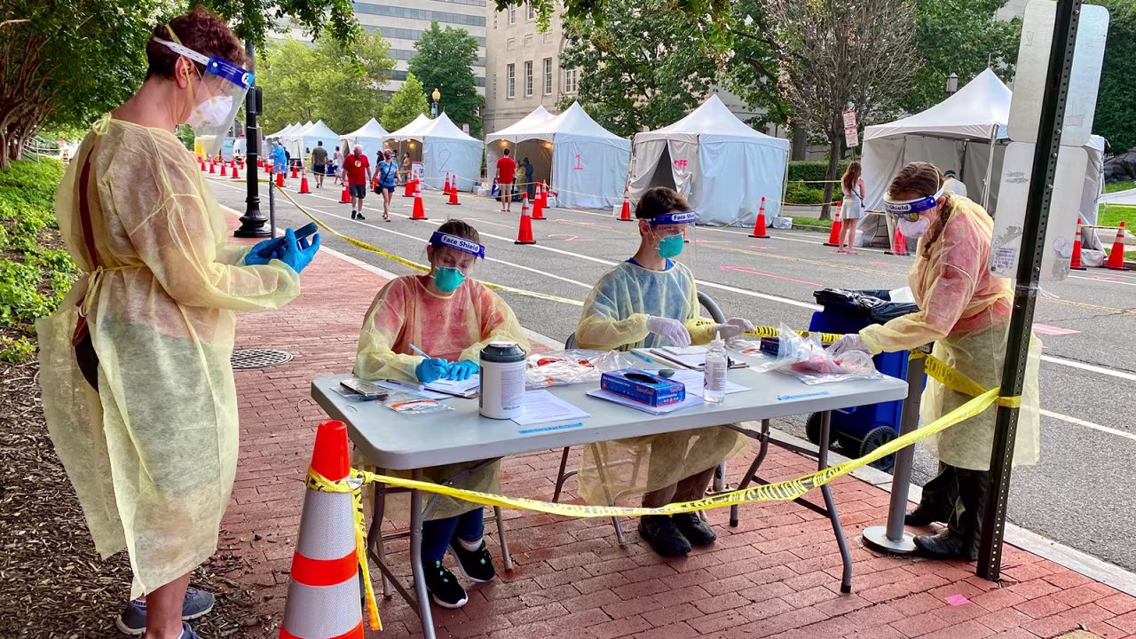 Health workers provide Covid-19 testing on a street in Washington, DC, on August 14.