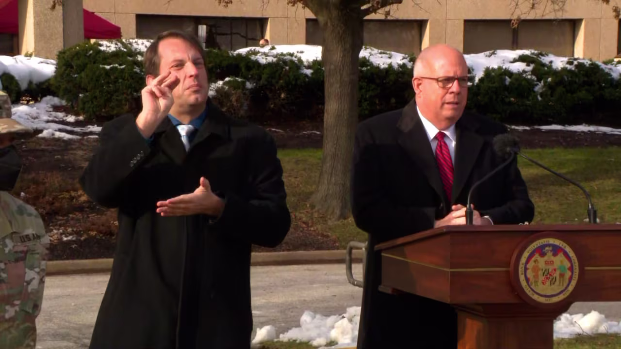 Maryland Gov. Larry Hogan, right, speaks during a briefing in Laurel, Maryland, on January 6.