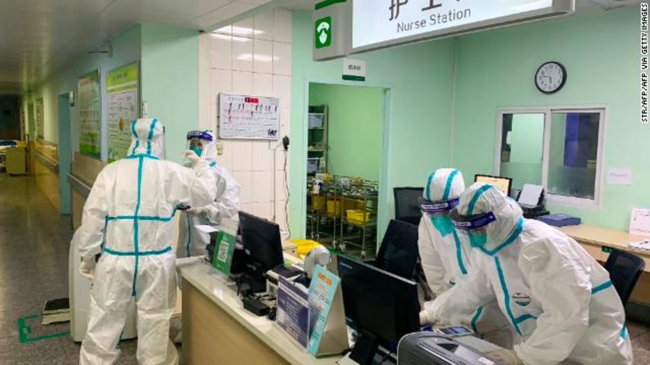 Medical staff members wear protective suits at the Zhongnan hospital in Wuhan.