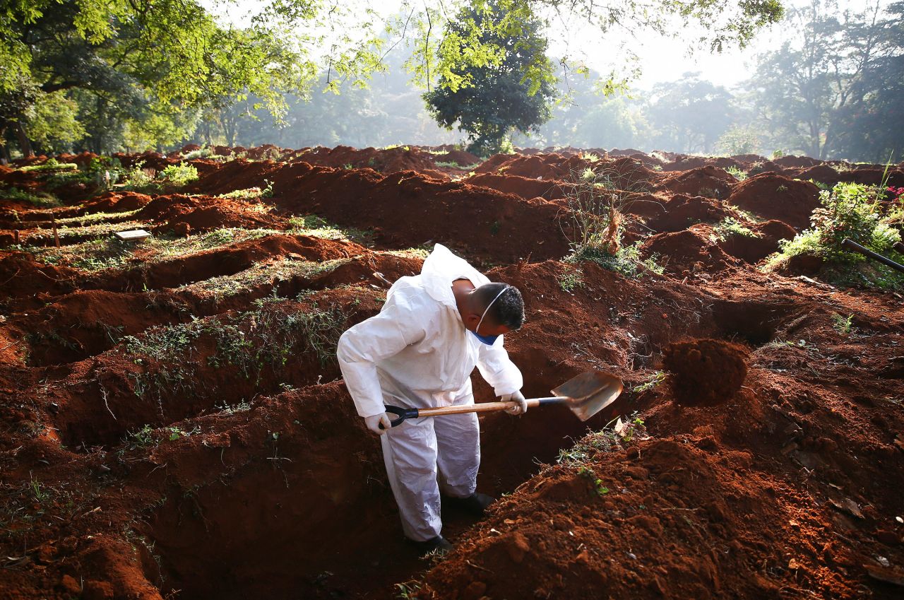 A cemetery worker digs a grave for a Covid-19 victim at Vila Formosa cemetery in Sao Paulo, Brazil, on May 19. 