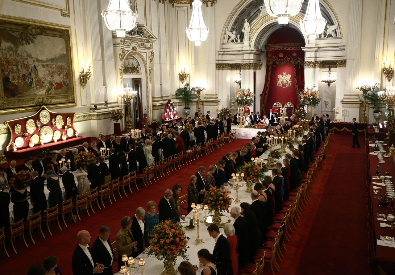 A general view shows guests seated as Britain's Queen Elizabeth II makes a toast during a State Banquet in honor of King Willem-Alexander and Queen Maxima of the Netherlands in 2018.