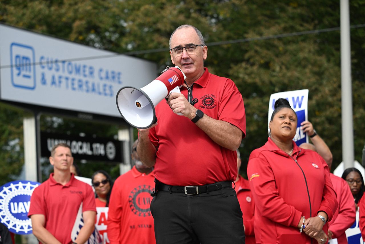 United Auto Workers (UAW) President, Shawn Fain addresses picketing UAW members at a General Motors Service Parts Operations plant in Belleville, Michigan, on September 26, 2023, as US President Joe Biden joined the workers.?