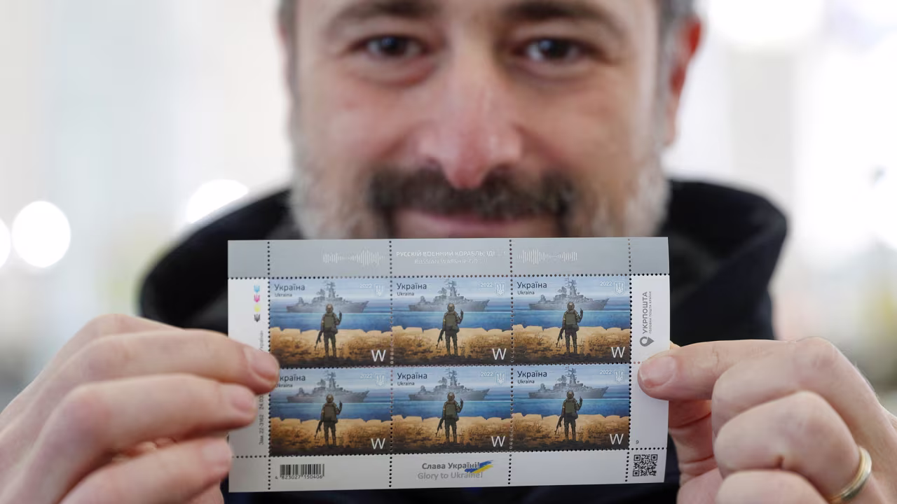 Ihor Smilianskyi CEO of the Ukrainian post holds the new postage stamp immortalizing the famous exchange on Snake Island between Russian and Ukrainian forces at the postal headquarters in Kyiv, Ukraine on April 14. 