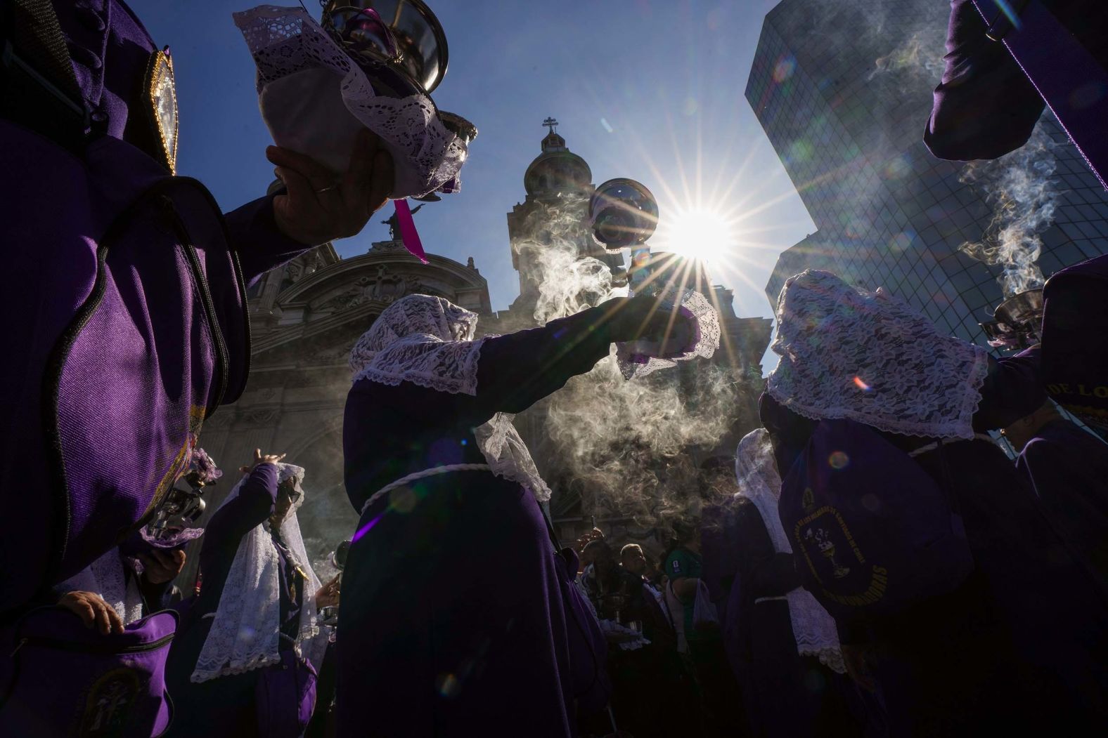 Women carry censers during the Lord of Miracles religious procession in Santiago, Chile, on Saturday, October 25.