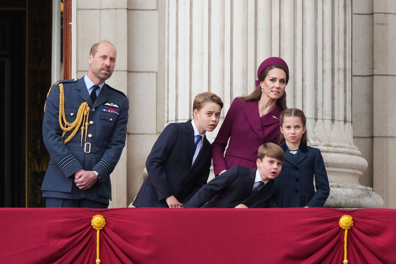 Britain’s Prince William; Catherine, the Princess of Wales; and their children — from left, Prince George, Prince Louis and Princess Charlotte — watch aircraft fly past Buckingham Palace during a <a href="index.php?page=&url=https%3A%2F%2Fwww.cnn.com%2F2025%2F05%2F05%2Fuk%2Fve-day-london-royals-intl">VE Day parade</a> in London on Monday, May 5. It has been 80 years since the end of World War II in Europe.
