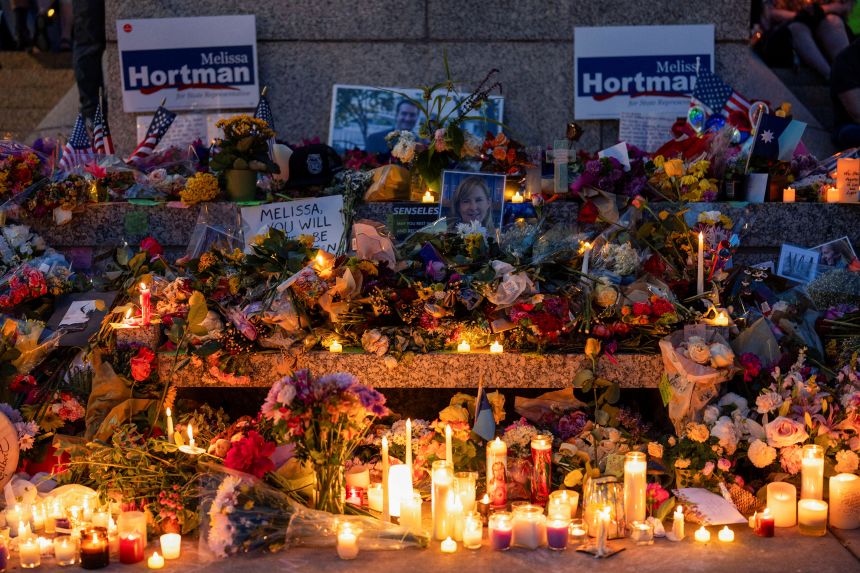 Candles and flowers adorn a memorial outside the Minnesota State Capitol in St. Paul following the killing of Democratic State Assemblywoman Melissa Hortman and her husband, Mark, in June.