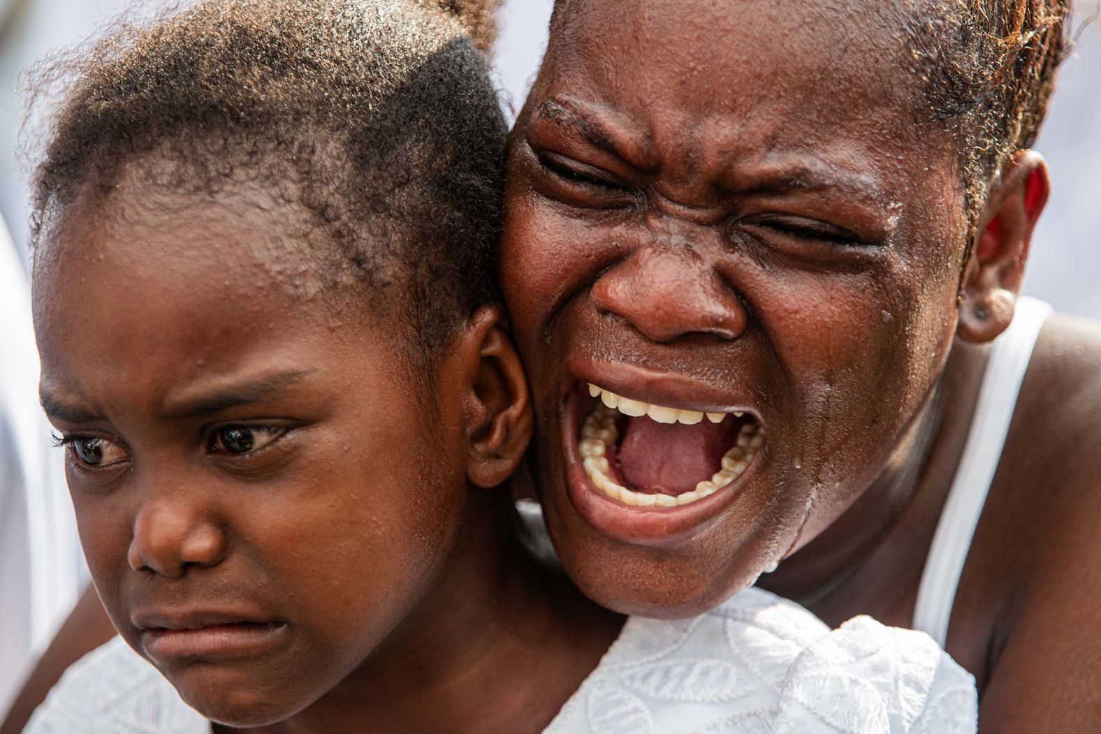 A woman cries during a funeral Saturday, October 4, for eight people who were killed in a drone strike last month in Port-au-Prince, Haiti. More than a dozen people — at least eight of them children — were killed in the attack, which targeted a suspected gang leader, <a href="index.php?page=&url=https%3A%2F%2Fapnews.com%2Farticle%2Fhaiti-drone-attack-cite-soleil-children-killed-339677efb2e5926b182f1934fafd6e5e" target="_blank">relatives and activists told The Associated Press last month</a>.