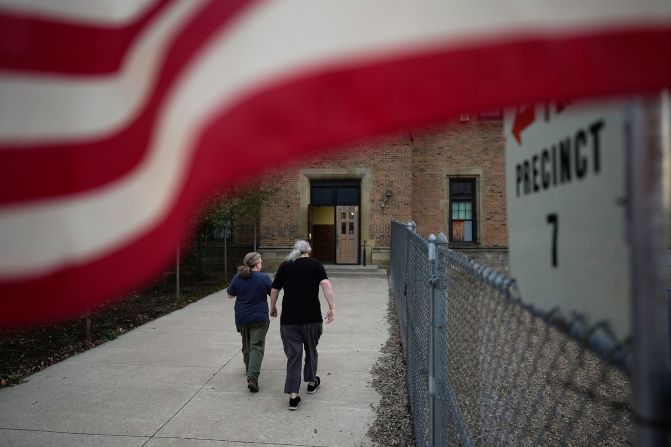 People arrive at a polling place in Dearborn, Michigan, on Tuesday.