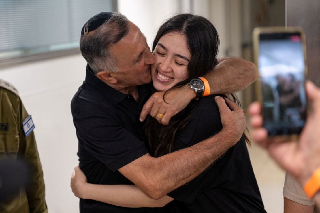 Noa Argamani, a rescued hostage, embraces her father, Yakov Argamani, after her rescue from central Gaza by Israeli forces on June 8, 2024.