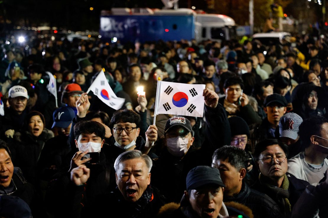 People gather outside the National Assembly in Seoul in the early morning of December 4.