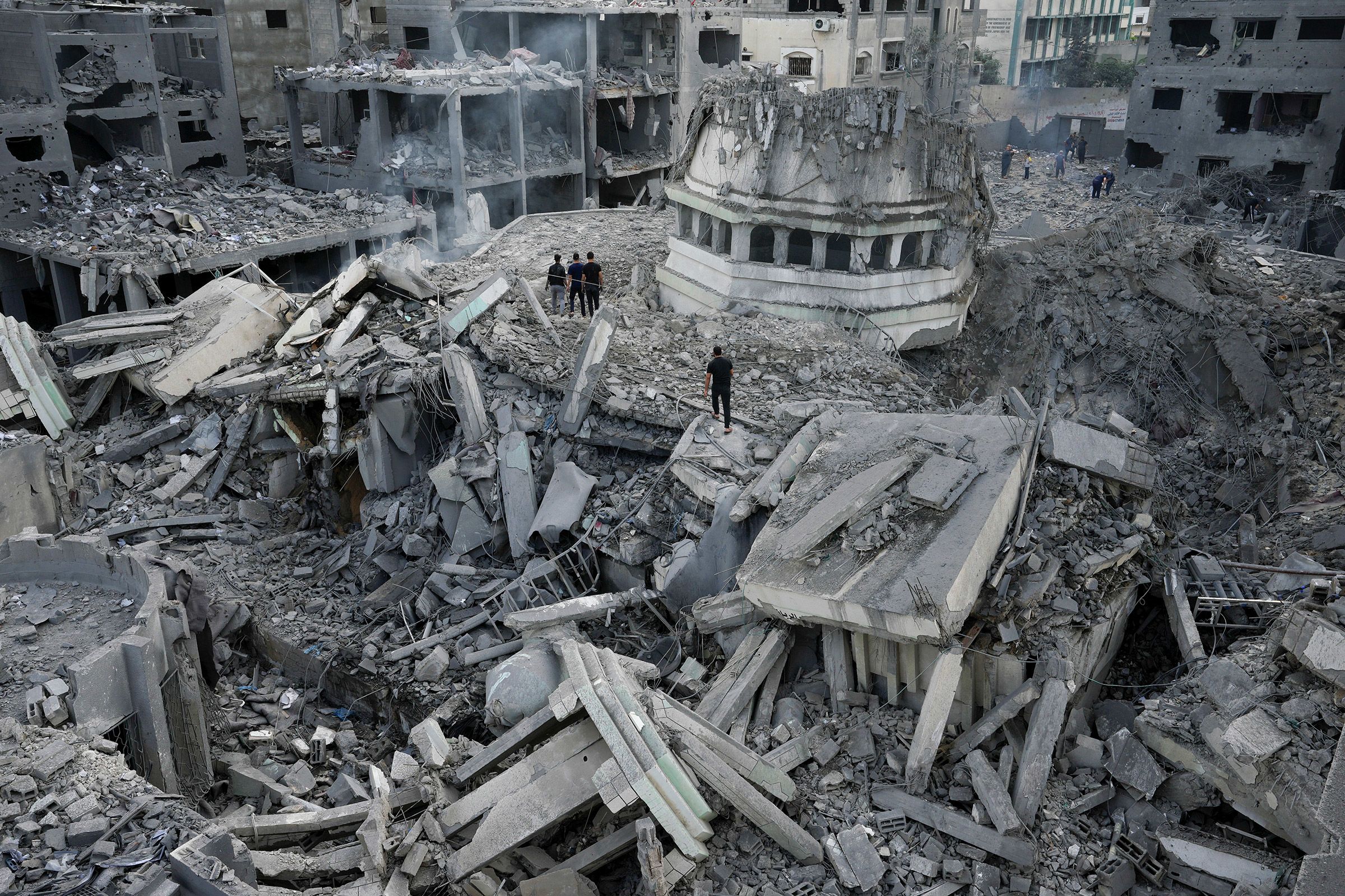 Palestinians inspect the rubble of the Yassin mosque after it was hit by an Israeli airstrike at the Shati refugee camp in Gaza City on October 9.