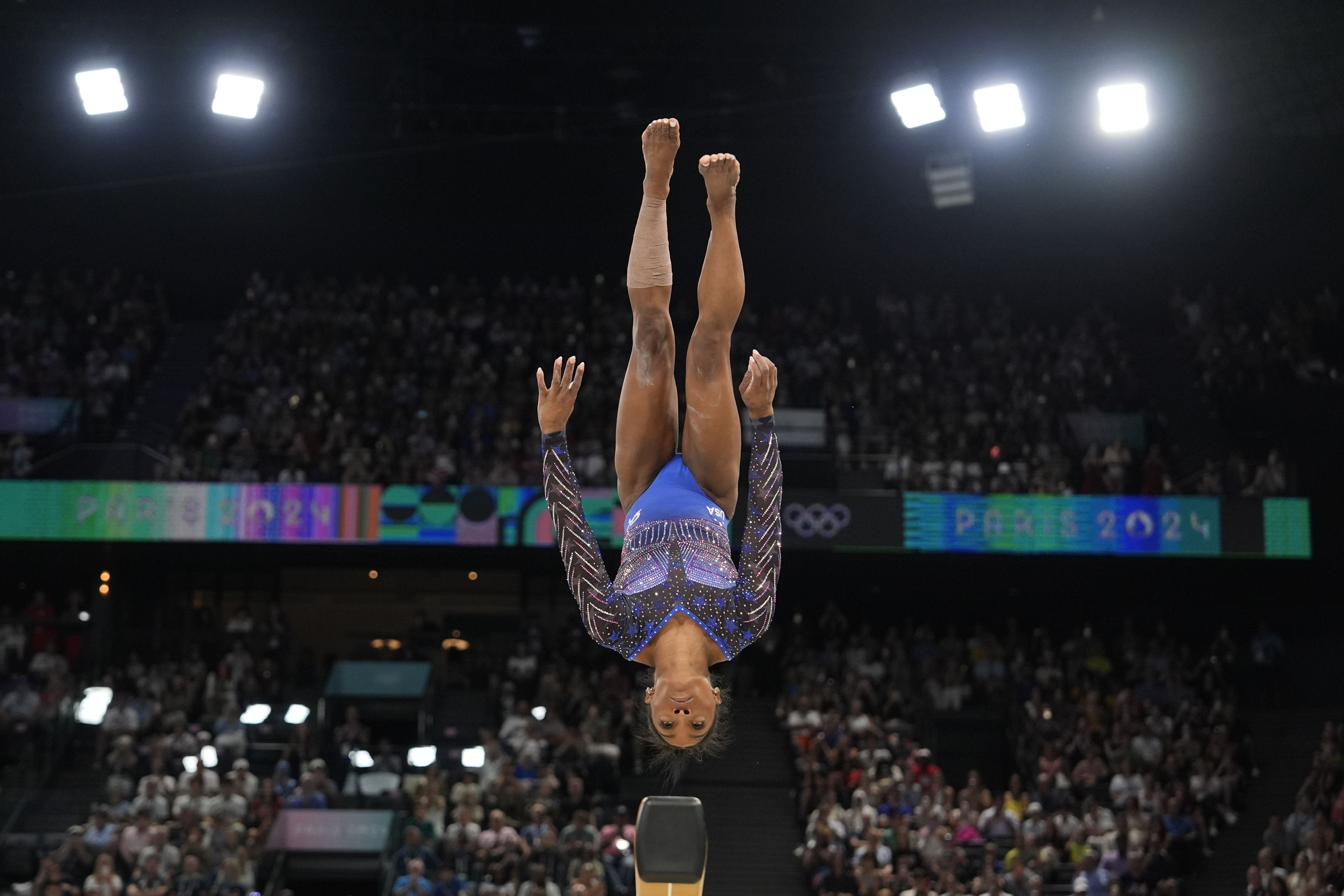 Biles performs on the balance beam, which was third in the four-apparatus rotation. She took the lead after the beam.