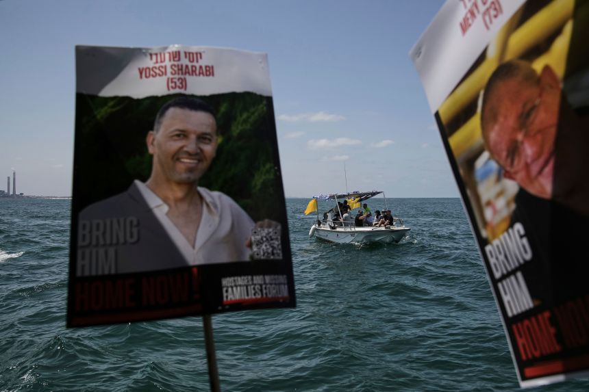 Relatives and supporters of Israeli hostages held by Hamas sail along the coast of Ashkelon on Thursday.