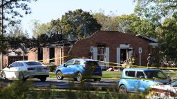 Fire and law enforcement officers stand outside the Church of Jesus Christ of Latter-day Saints, Sunday, Sept. 28, 2025 in Grand Blanc, Mich. (AP Photo/Carlos Osorio)