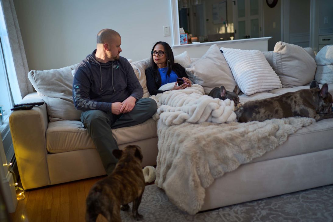Ruth Wilson with her husband, Jim, and their three dogs at their home in Littleton.