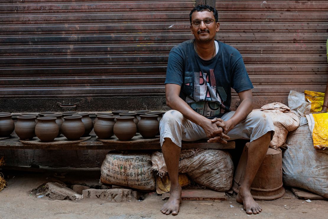 Dhanshuk Purshottamwala, 42, poses for a picture during an interview with CNN in Dharavi on April 14.