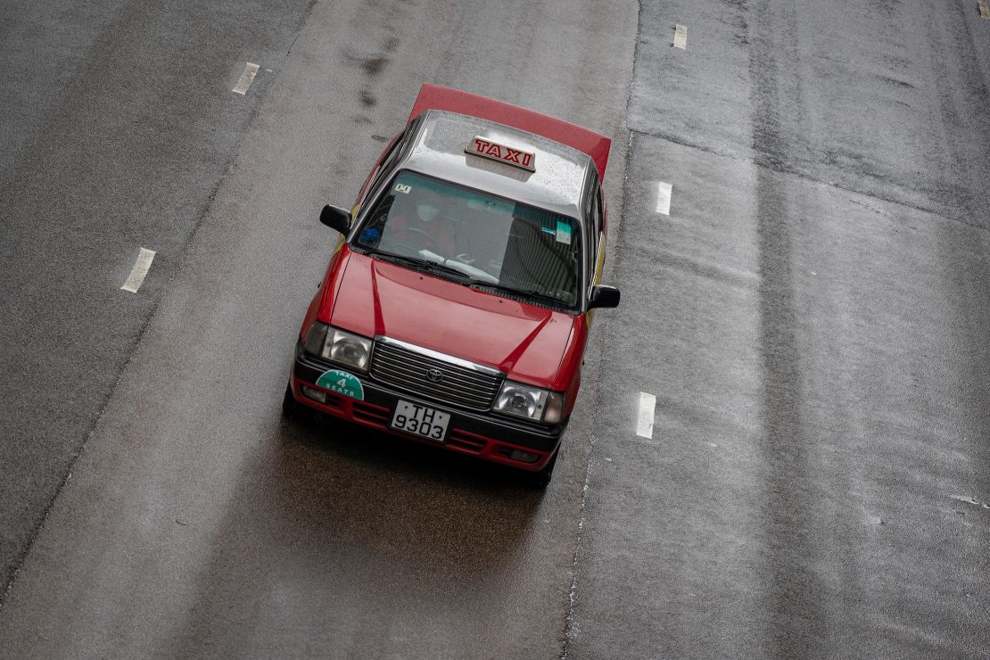 A taxi is passing through Central, in Hong Kong, China on May 24, 2024.