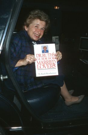 Westheimer holds a copy of one of her books in Beverly Hills, California, in 1986. She ended many of her shows by urging her audience to “have good sex!”