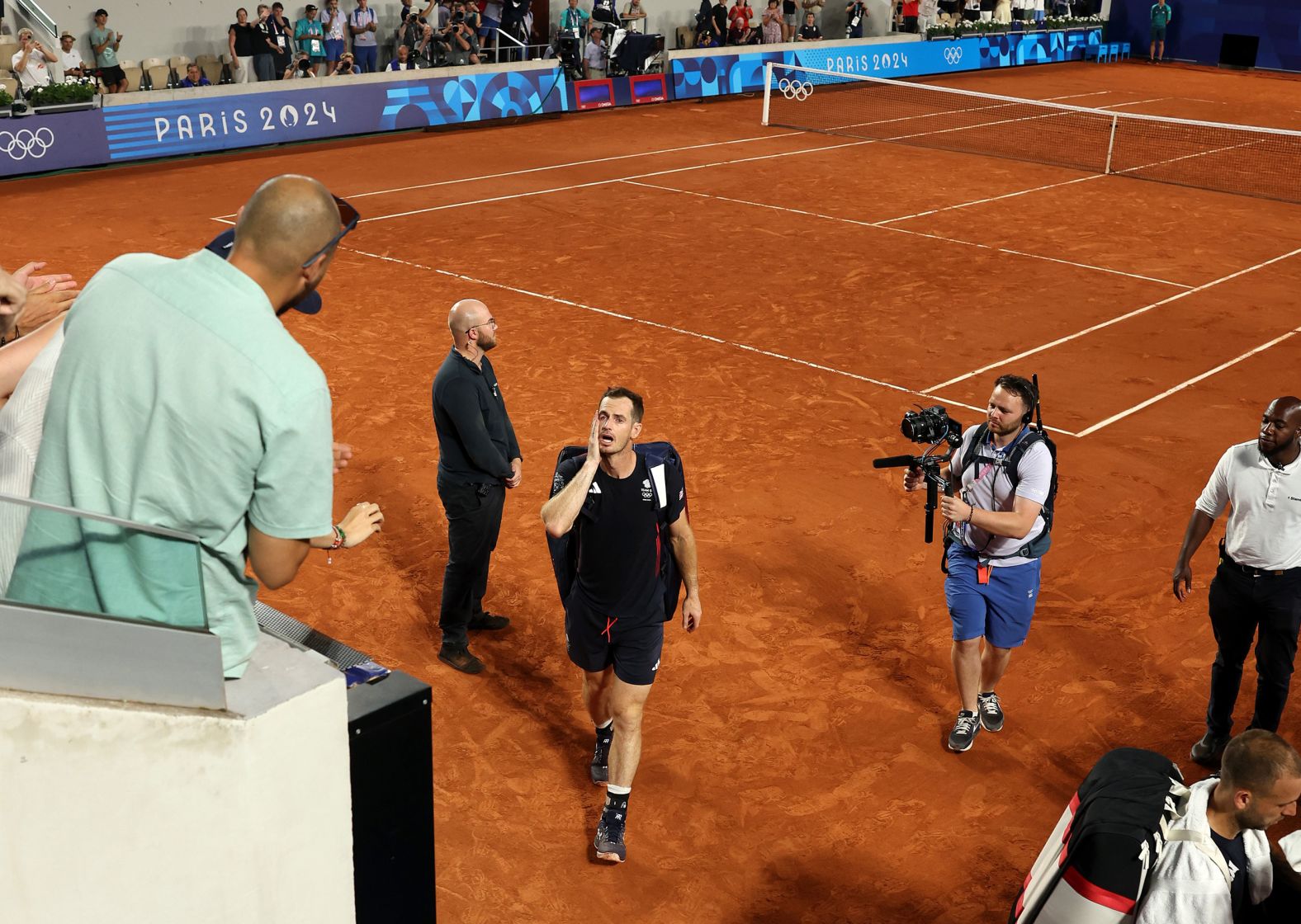 A tearful Andy Murray leaves the court after he and doubles partner Dan Evans <a >lost in the quarterfinals</a> on August 1. Murray, a three-time grand slam winner, is retiring from the sport.