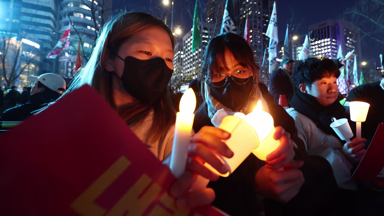 Demonstrators attend a candlelight rally against Yoon.