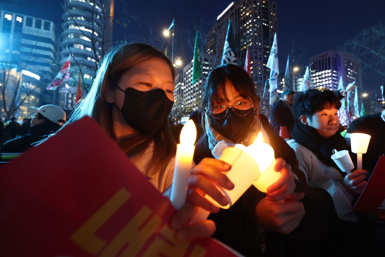 Demonstrators attend a candlelight rally against Yoon.