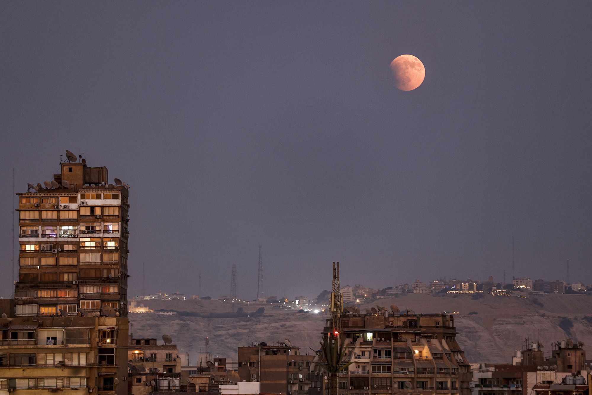 The blood moon is pictured near the beginning of the lunar eclipse above Cairo.