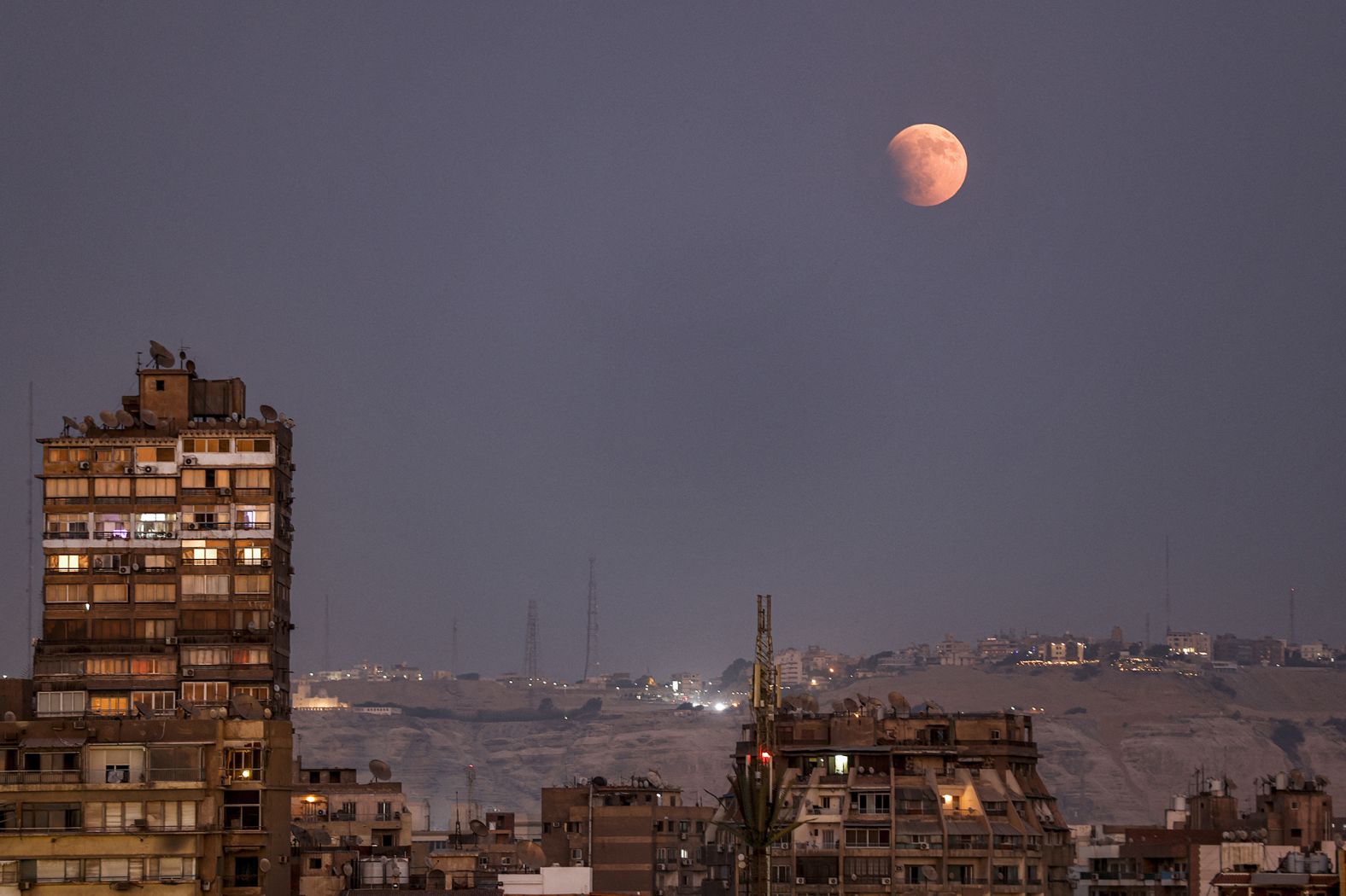 The blood moon is pictured near the beginning of the lunar eclipse above Cairo.
