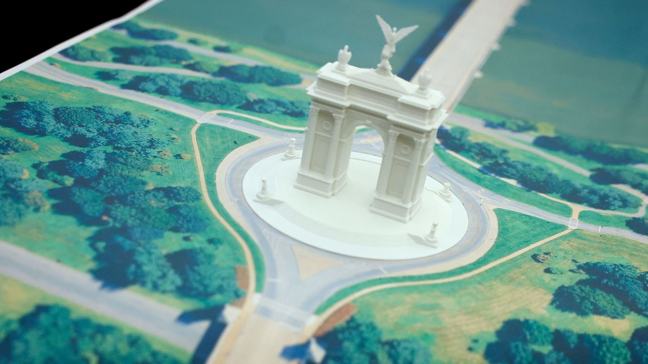 A model of President Donald Trump's proposed triumphal arch to commemorate the country’s 250th anniversary is seen on the Resolute Desk in the Oval Office on October 15, 2025.