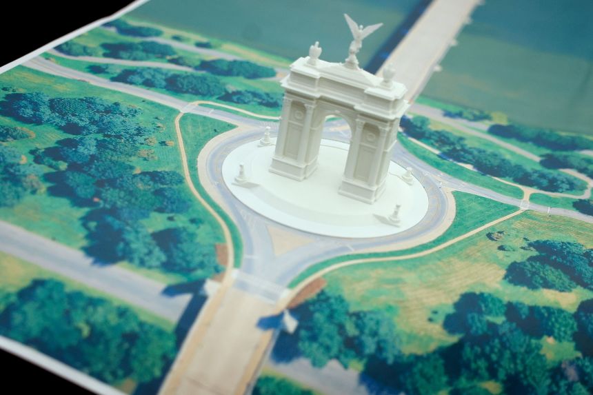 A model of President Donald Trump's proposed triumphal arch, to commemorate the country’s 250th anniversary, is seen on the Resolute Desk on October 15.