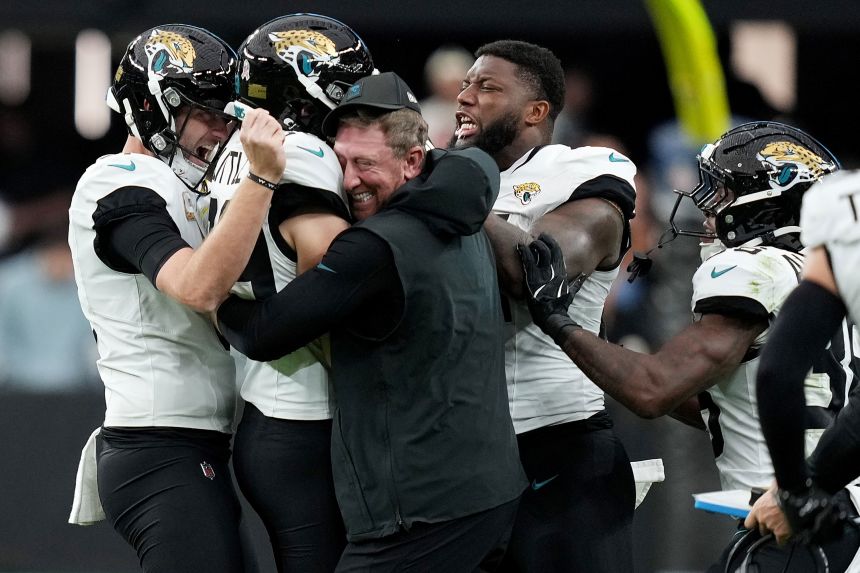 Jacksonville Jaguars kicker Cam Little celebrates with his team after setting an NFL record with his 68-yard field goal -- coming at the end of the first half against the Las Vegas Raiders.