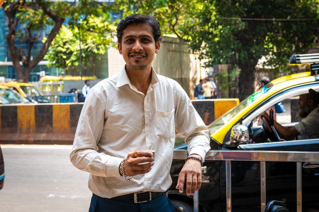 Salesperson Parag Sawla drinks chai during a break in Mumbai, India, on April 16, 2024.