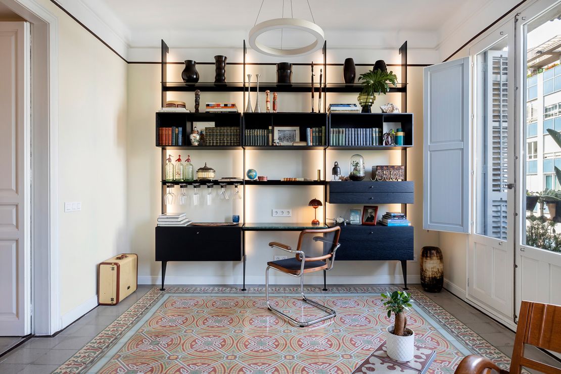 Colorful tile throughout the apartment helps delineate different living spaces, including this work area.