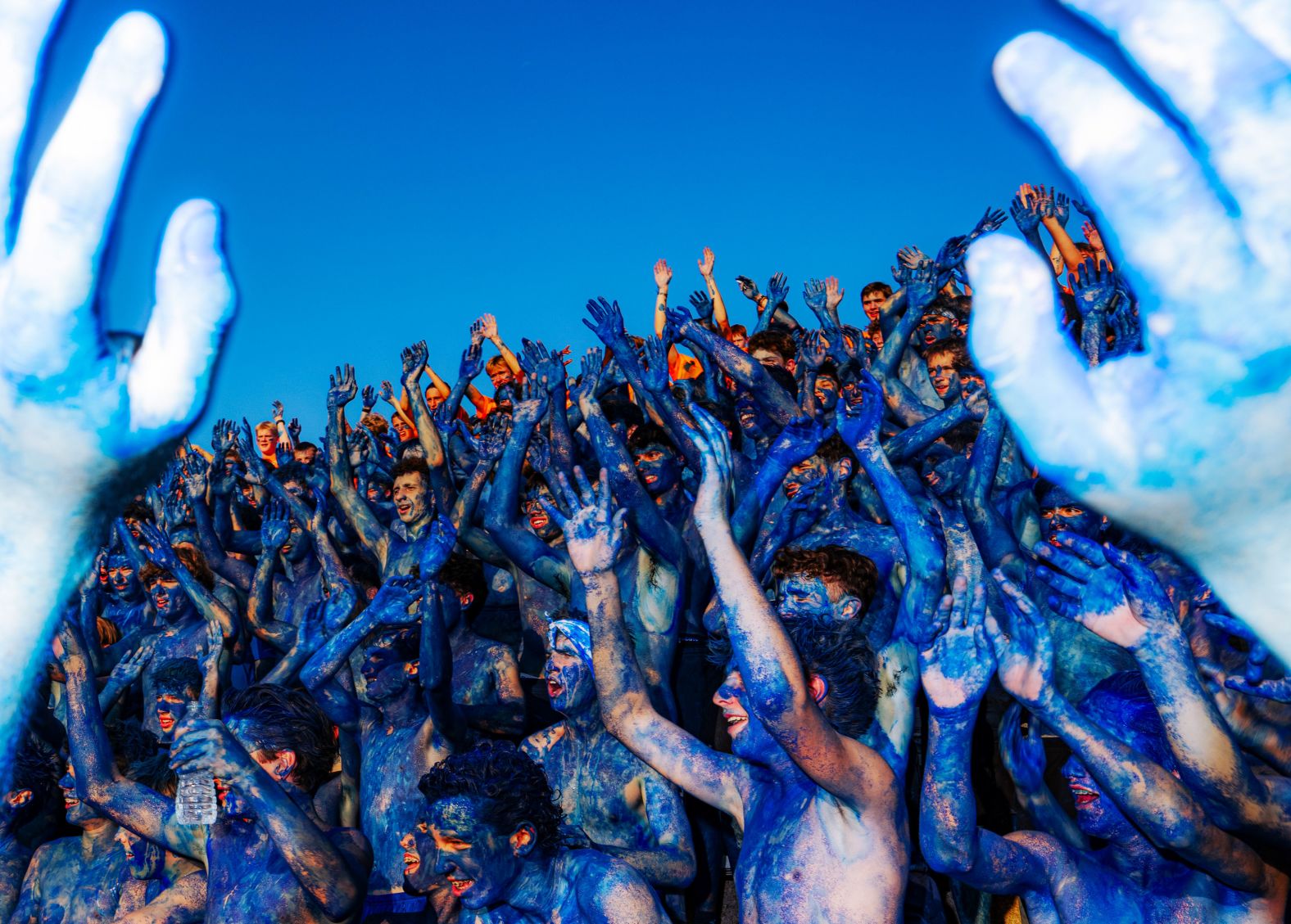 Students from St. Louis University High School take part in the school’s annual “running of the bills” tradition on Saturday, August 30. Freshman cover themselves in blue paint and run into the football stadium for the first game of the year.