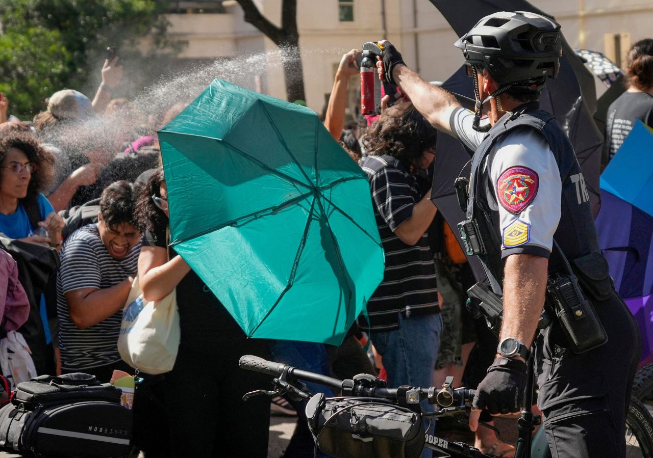 A state trooper pepper sprays pro-Palestinian protesters at the University of Texas in Austin on Monday.