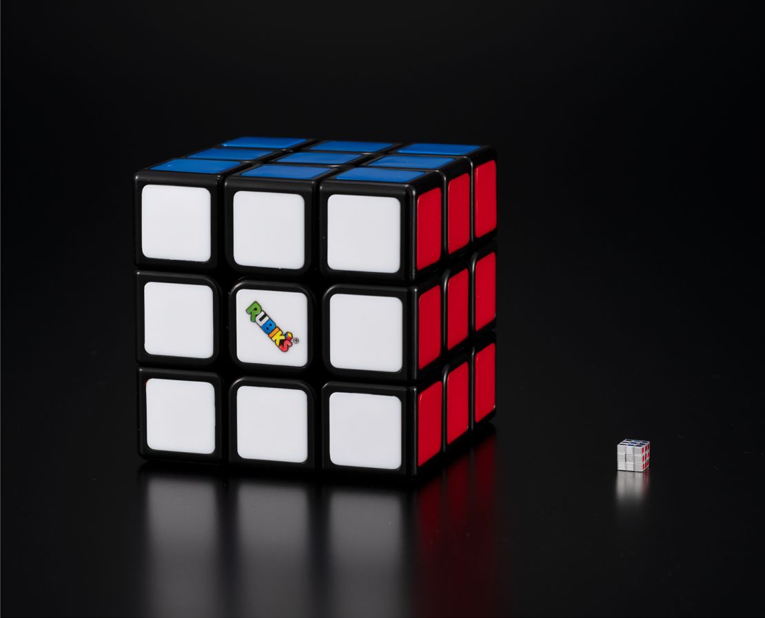 The miniature cube in comparison to a standard one.