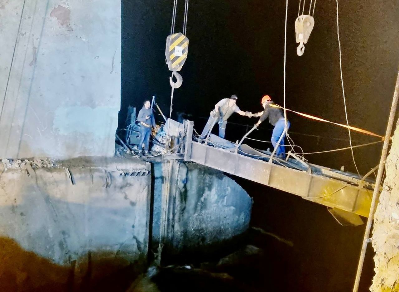 Workers repair a hydraulic structure damaged by a Russian missile strike in Kryvyi Rih, Ukraine on September 15.