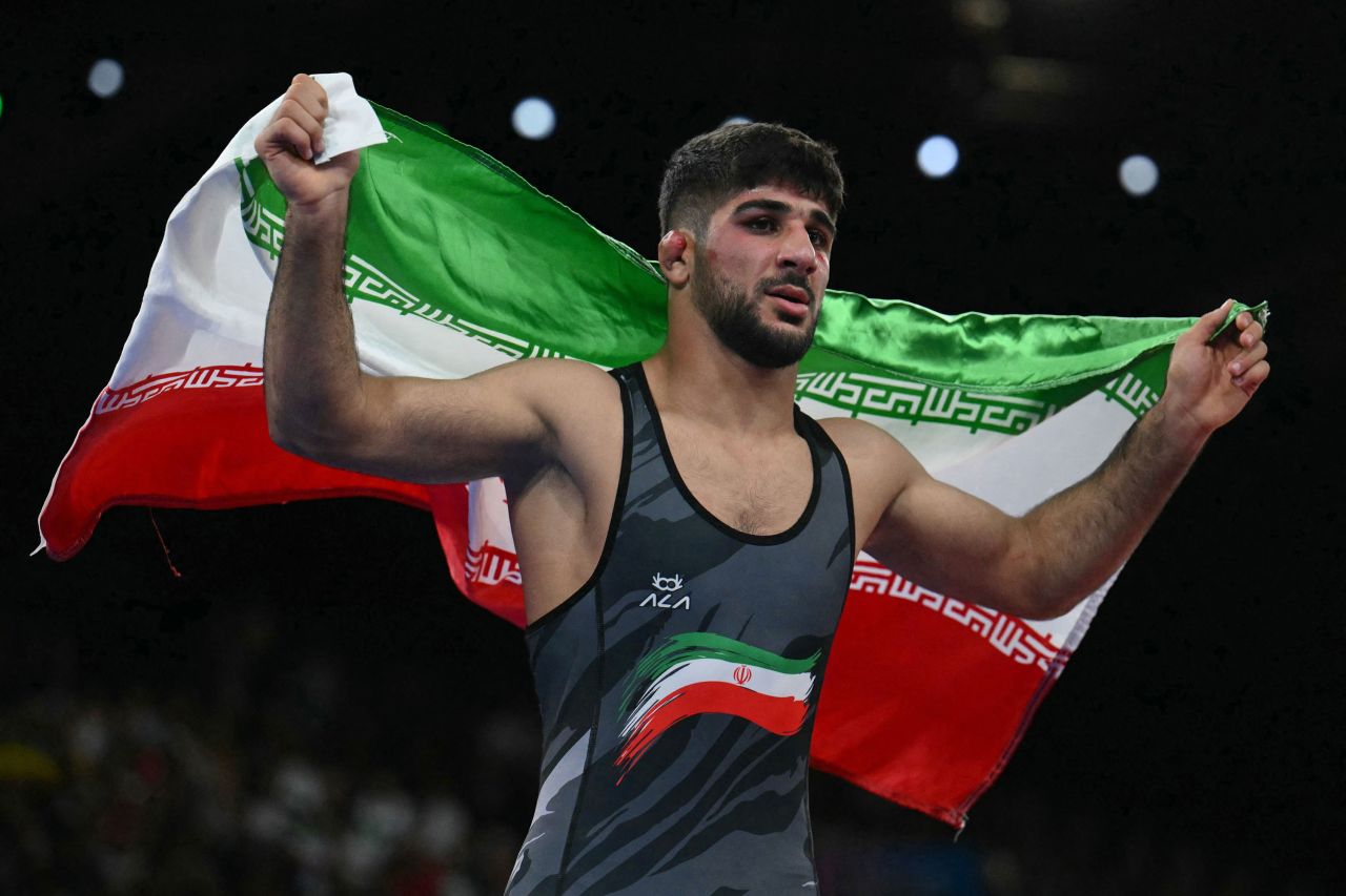 Iran's Saeid Esmaeili celebrates after beating Ukraine's Parviz Nasibov on Thursday.