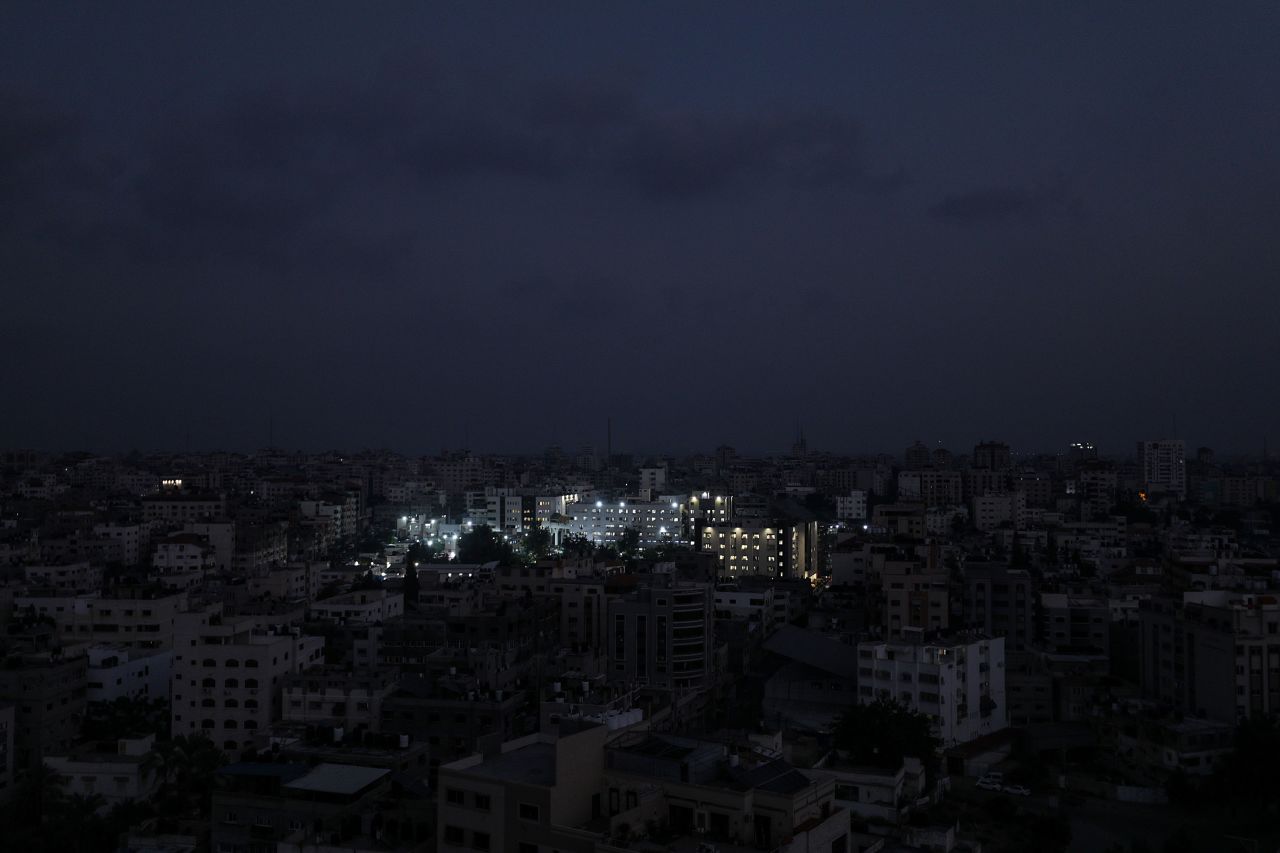 Al Shifa hospital is lit up amid fuel shortages in Gaza City on October 24. 