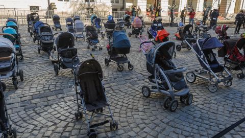 Empty baby strollers are seen during The price of War demonstration in Rynok Square in Lviv, Ukraine on March 18, to draw attention to the deaths of Ukrainian children.