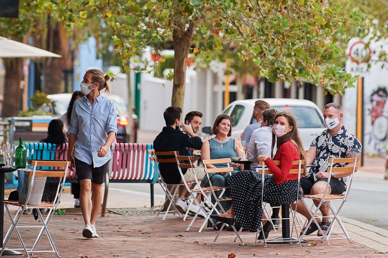 People dine out at a restaurant in Perth, Australia, on February 5.