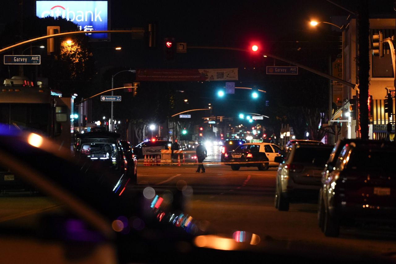 Police investigate the scene where a shooting took place in Monterey Park on Sunday.