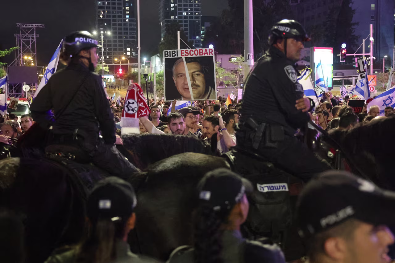 Police block the road ahead of demonstrators calling for the release of Israeli hostages in Tel Aviv, Israel on June 8.