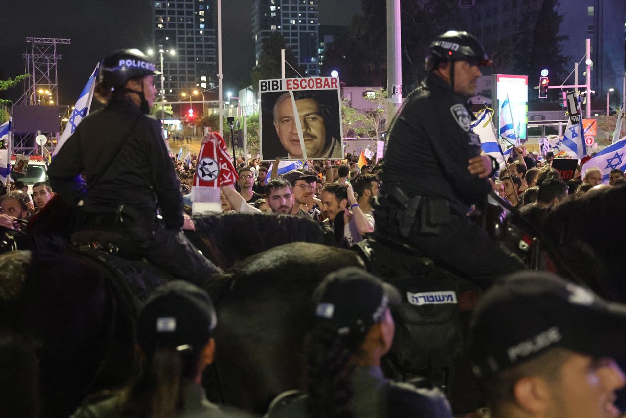 Police block the road ahead of demonstrators calling for the release of Israeli hostages in Tel Aviv, Israel on June 8.