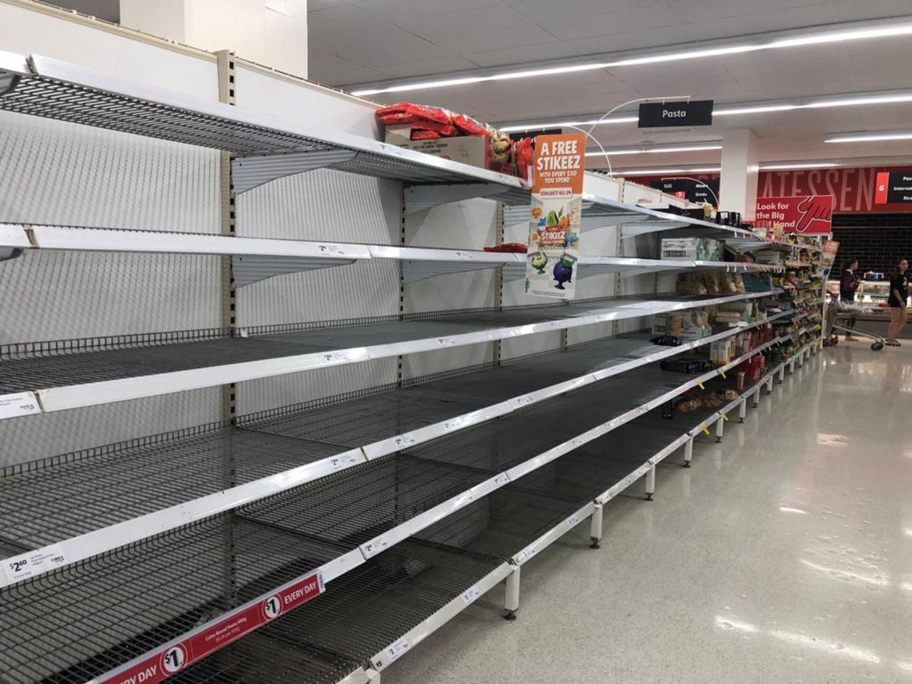 Empty shelves in the pasta section of Coles supermarket at Greenslopes Mall in Brisbane, Australia. 